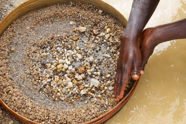 Child washing diamons