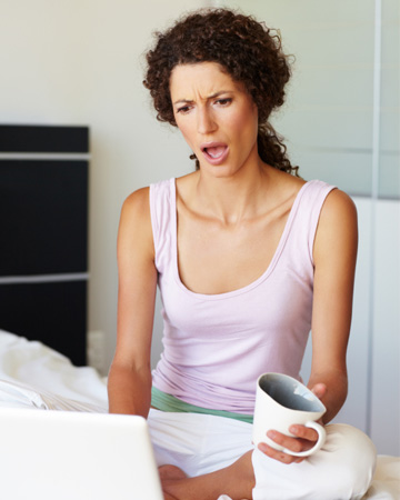 Confused woman on computer