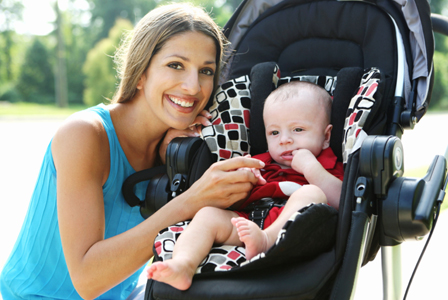 Woman with baby in a stroller