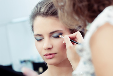 Woman having makeup applies