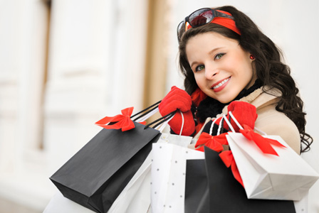 Happy woman with shopping bags